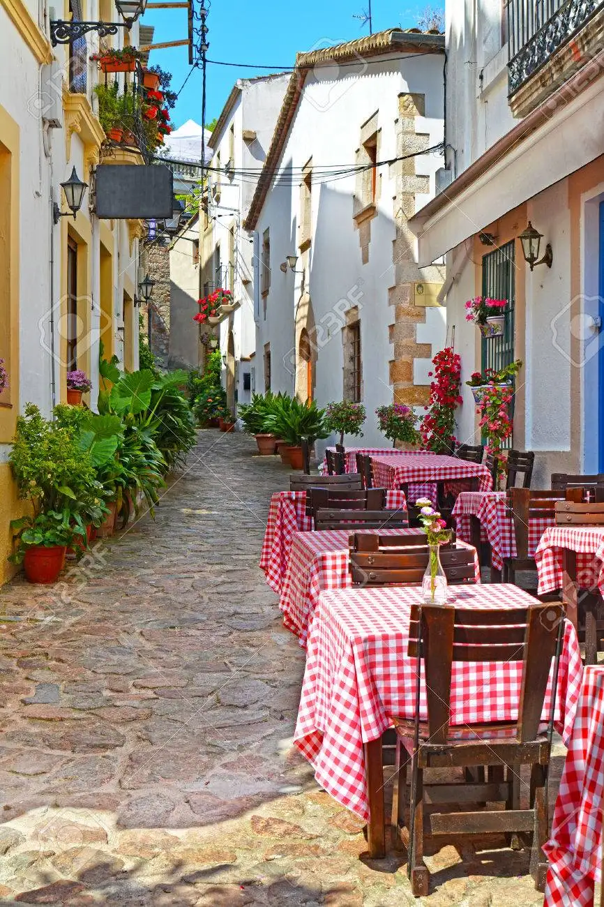 53586789_view_of_outdoor_cafe_on_narrow_street_in_the_old_european_mediterranean_city_at_summer.jpg